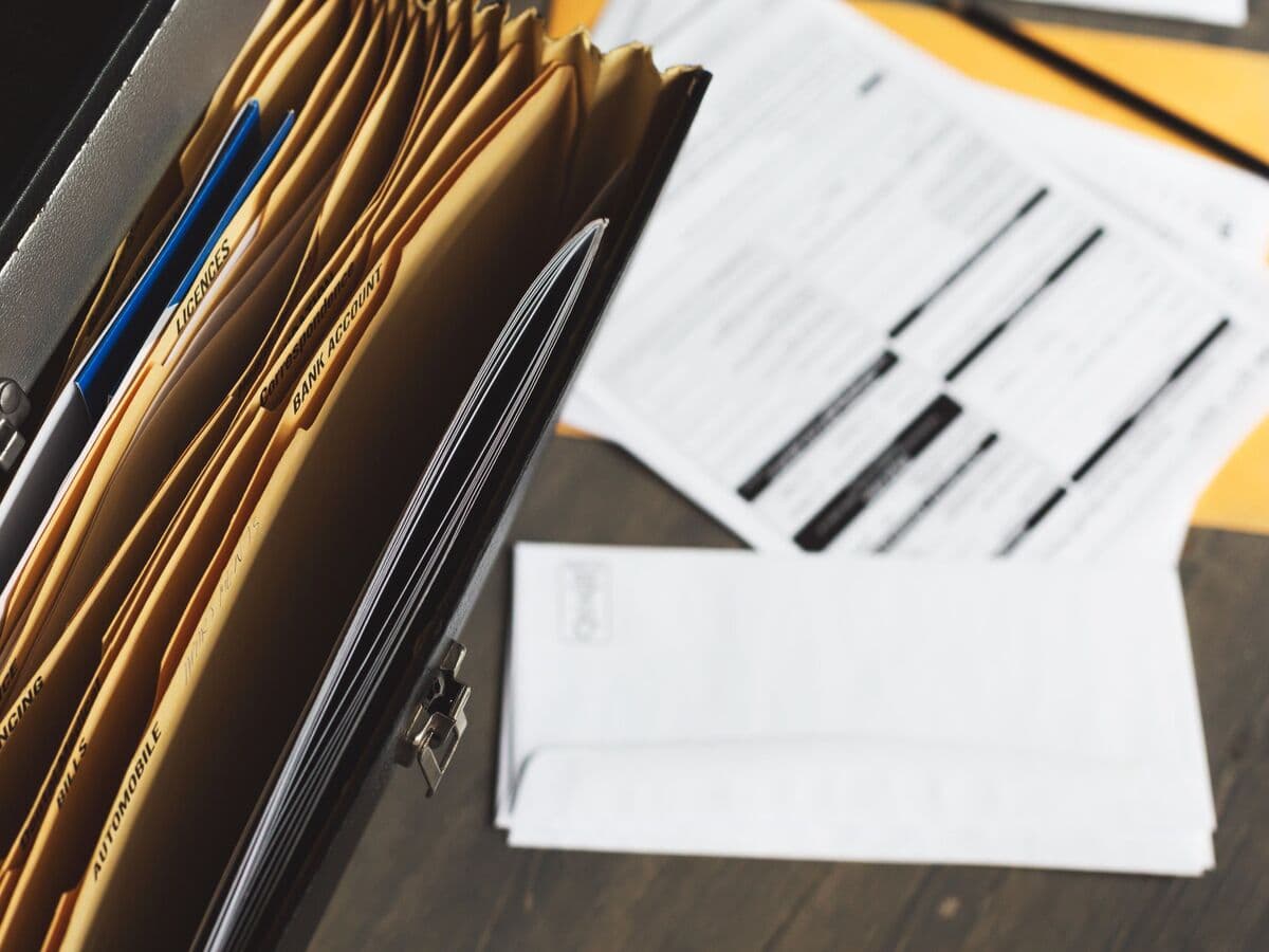 Accordion file of estate paperwork on a desk